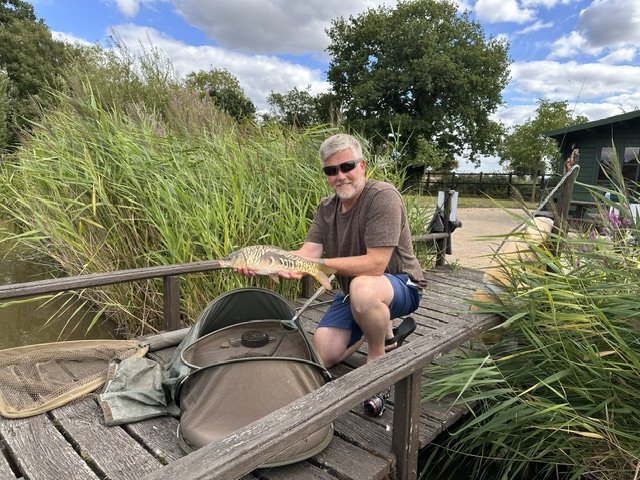 Catch of the day at Scotgate Cottages well-stocked fishing lake, Norfolk